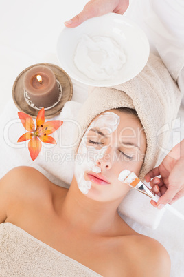 Attractive woman receiving treatment at spa center