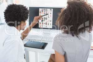 Young editorial team working together at desk