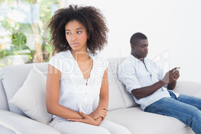 Attractive couple not talking on the couch