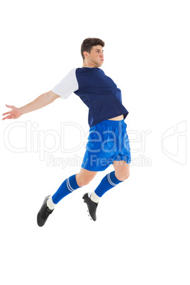 Football player in blue jersey jumping