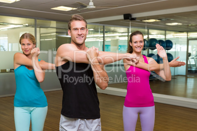 Fitness class led by handsome instructor