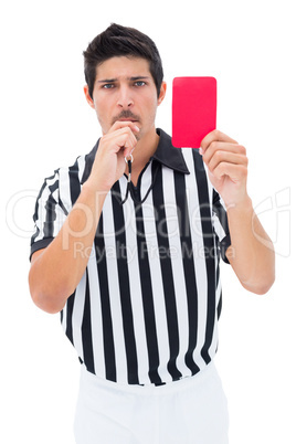 Serious referee showing red card