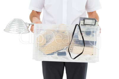 Businessman holding box of his things