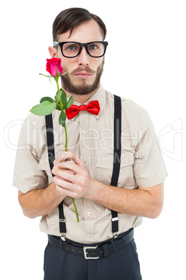 Geeky hipster offering a rose