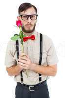 Geeky hipster offering a rose