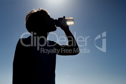 Man drinking from water bottle