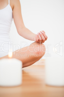 Peaceful blonde sitting in lotus pose