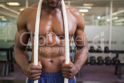 Muscular young muscular man in gym