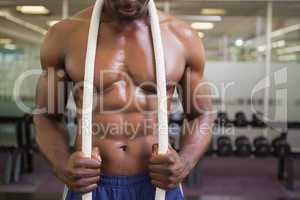 Muscular young muscular man in gym