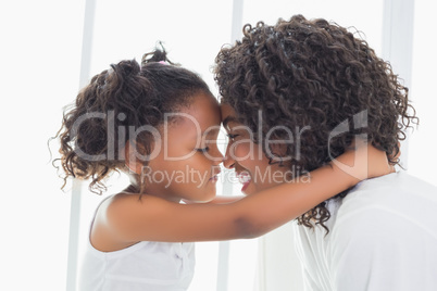 Cute little girl hugging her mother