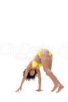 Fit girl in yellow bikini bending
