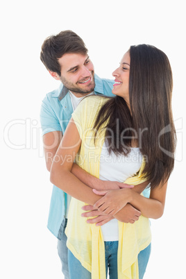 Happy casual couple smiling at each other Happy casual couple smiling at each other