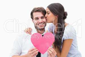 Pretty brunette giving boyfriend a kiss and her heart