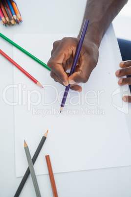 Man drawing with colour pencils