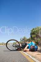 Cyclist lying on the road after an accident