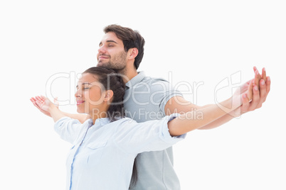 Cute couple standing with arms out