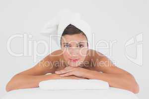 Portrait of a beautiful young woman on massage table