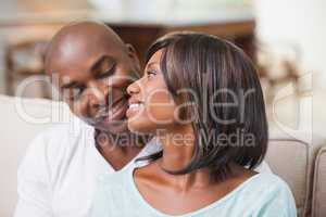 Happy couple relaxing on the couch