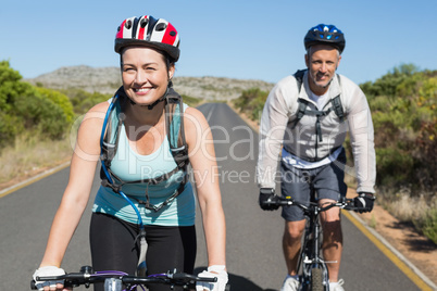 Active couple going for a bike ride in the countryside