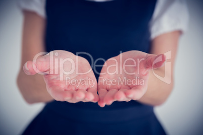 Businesswoman presenting your product with hands