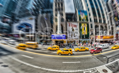 NEW YORK CITY - MAY 23, 2013: Yellow cabs speed up in Manhattan.