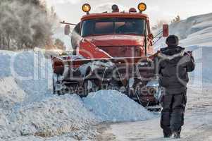 Worker controls snow cleaning process