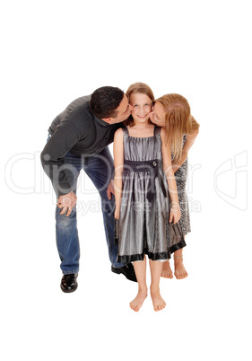 Parents kissing there daughter.