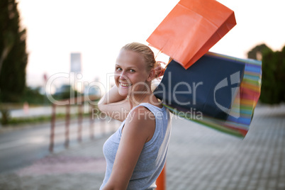 Young woman outdoor excited at good shopping