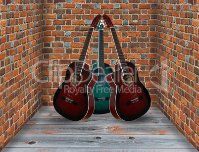 three guitars in the corner of the room