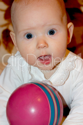 little baby playing with ball