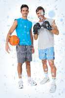 Composite image of two fit men with boxing gloves and basketball