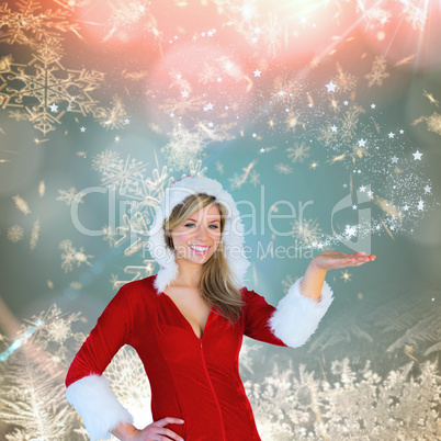 Composite image of pretty girl presenting in santa outfit