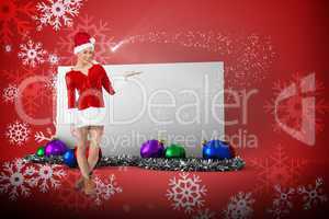 Composite image of pretty santa girl presenting with hand