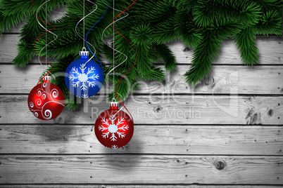 Composite image of digital hanging christmas bauble decoration