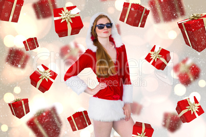 Composite image of cool santa girl wearing sunglasses