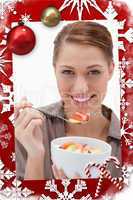 Composite image of woman eating fruit salad