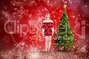 Composite image of pretty girl smiling in santa outfit