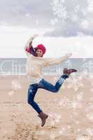 Composite image of woman in stylish warm clothing jumping at bea