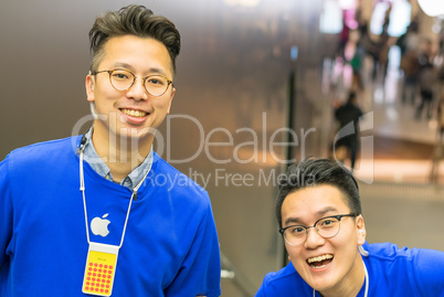 HONG KONG, APRIL 20, 2014: Apple Store employees smile to the cu