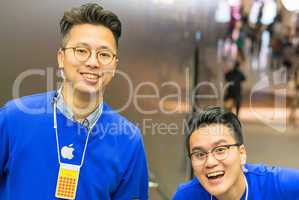 HONG KONG, APRIL 20, 2014: Apple Store employees smile to the cu