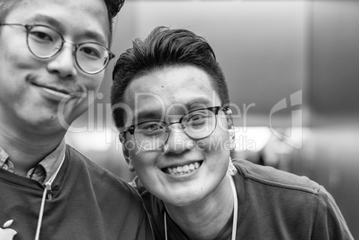 HONG KONG, APRIL 20, 2014: Apple Store employees smile to the cu