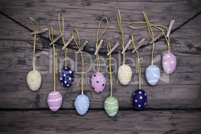 Many Colorful Easter Eggs Hanging On Line  With Frame