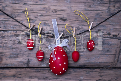 Many Red Easter Eggs And One Big Egg Hanging On Line