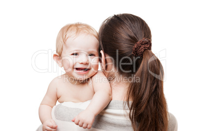 Loving mother holding little newborn smiling baby child