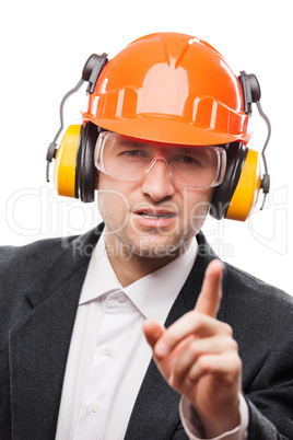 Businessman in safety hardhat helmet gesturing exclamation point