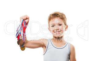 Smiling athlete champion child boy gesturing for victory triumph