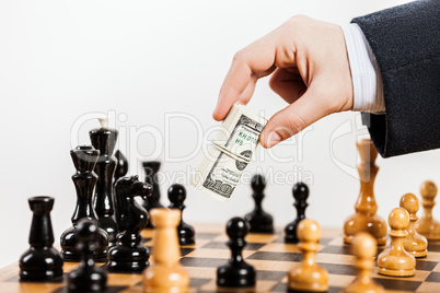 Business man unfair playing chess game