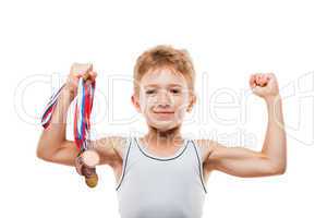 Smiling athlete champion child boy gesturing for victory triumph