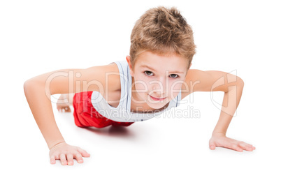 Smiling sport child boy press up exercising