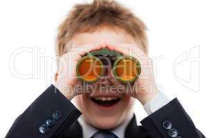 Child boy in business suit holding binoculars lens looking for d